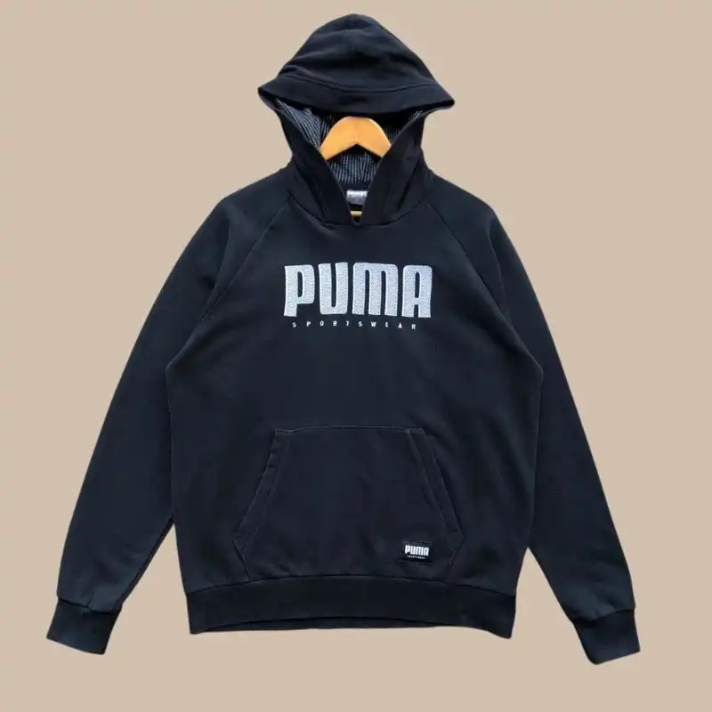 Black PUMA hoodie on hanger with flat shoulders and no sleeve volume